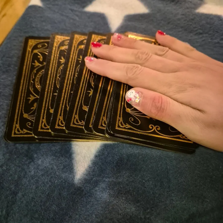 Oracle cards spread on a blanket