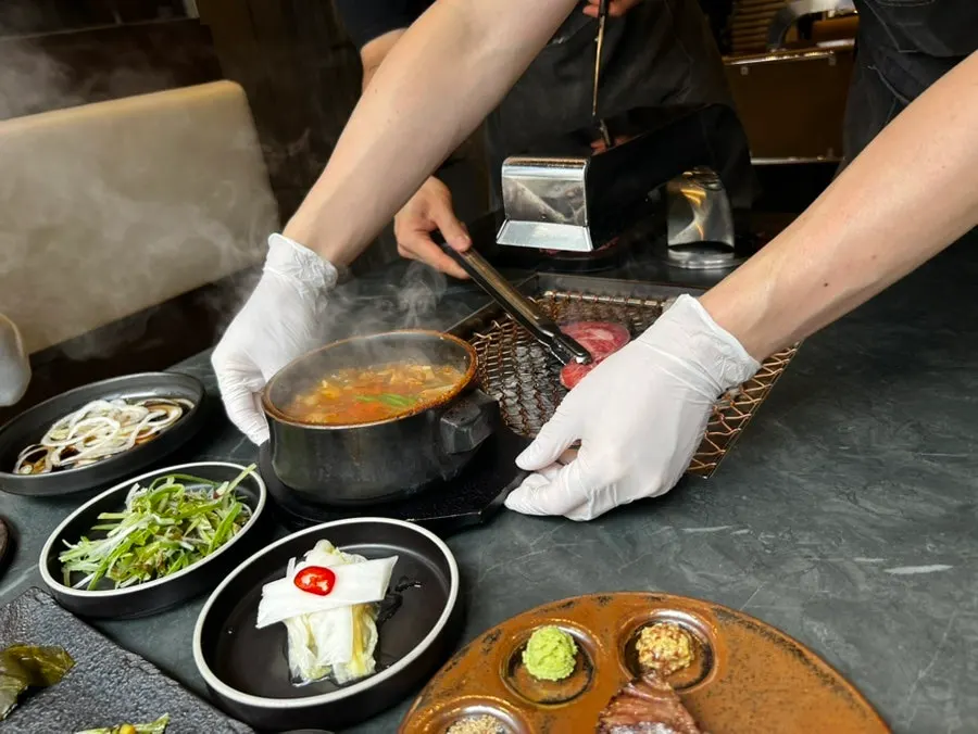 Seonghwa sirloin browning over charcoal