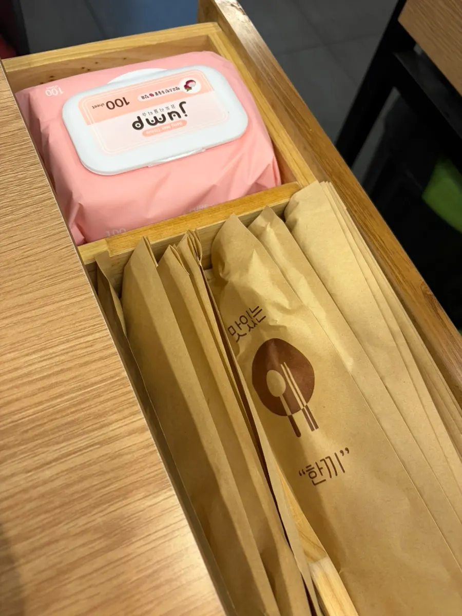 Spoons and wet wipes set out in envelopes
