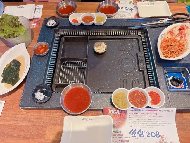 Ssosam 208's spread of basic side dishes and sauces