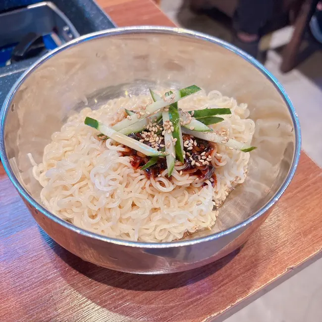 Paldo Bibimmyeon topped with cucumber
