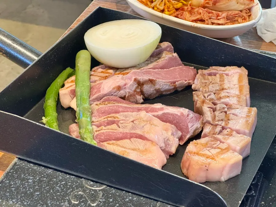 Table spread with the Ogamdong Set: pork belly, pork neck, and pork jowl