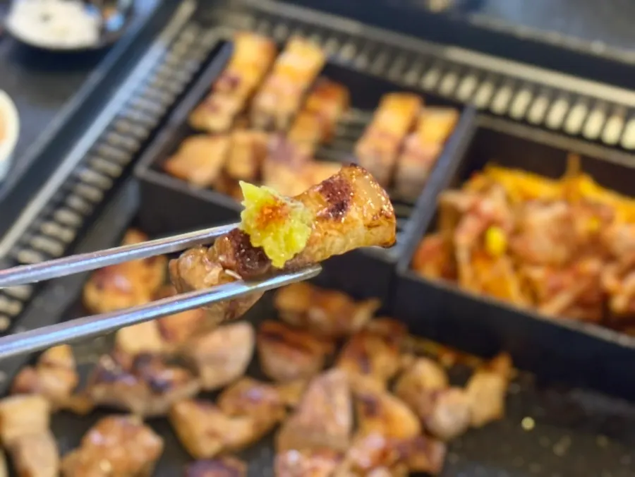 Charcoal pre-grilled pork belly turning golden brown