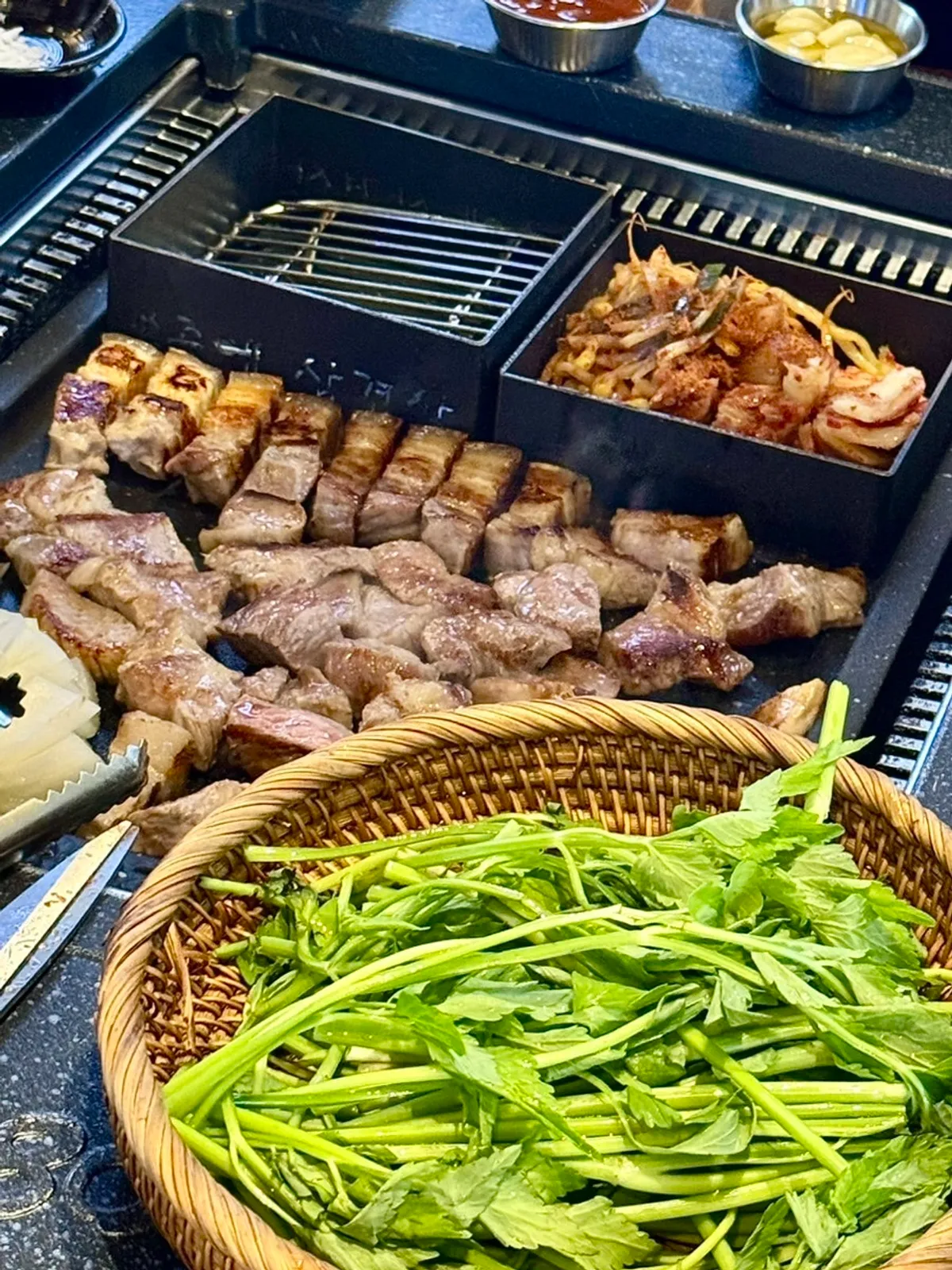 Pork neck and pork jowl grilled and sliced into bite-size pieces