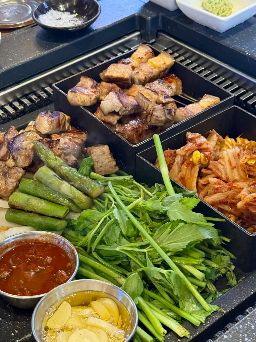 Minari and pork belly added to the grill