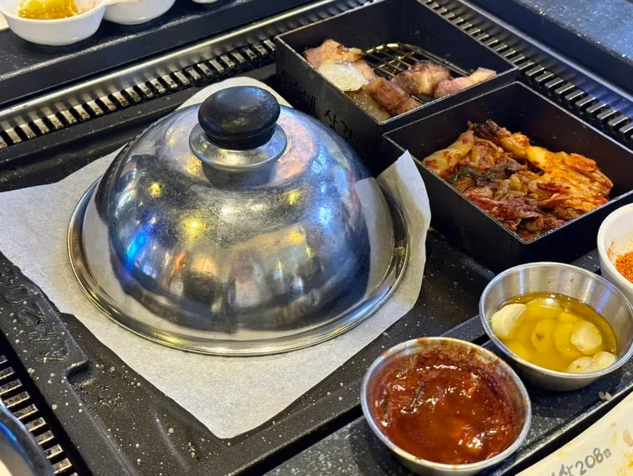 Non-alcoholic beer with the meat spread on the table