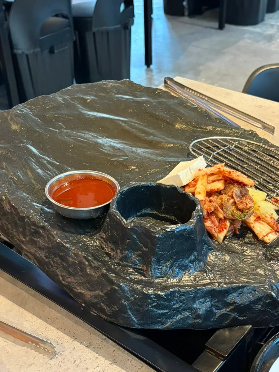Signature stone plate with a crater for cheese at Ssosam 208