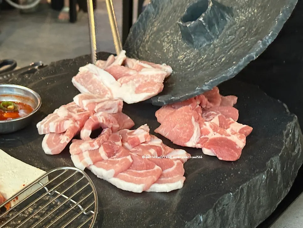 Raw cuts of pork belly, pork neck, and cheonkyeopsal