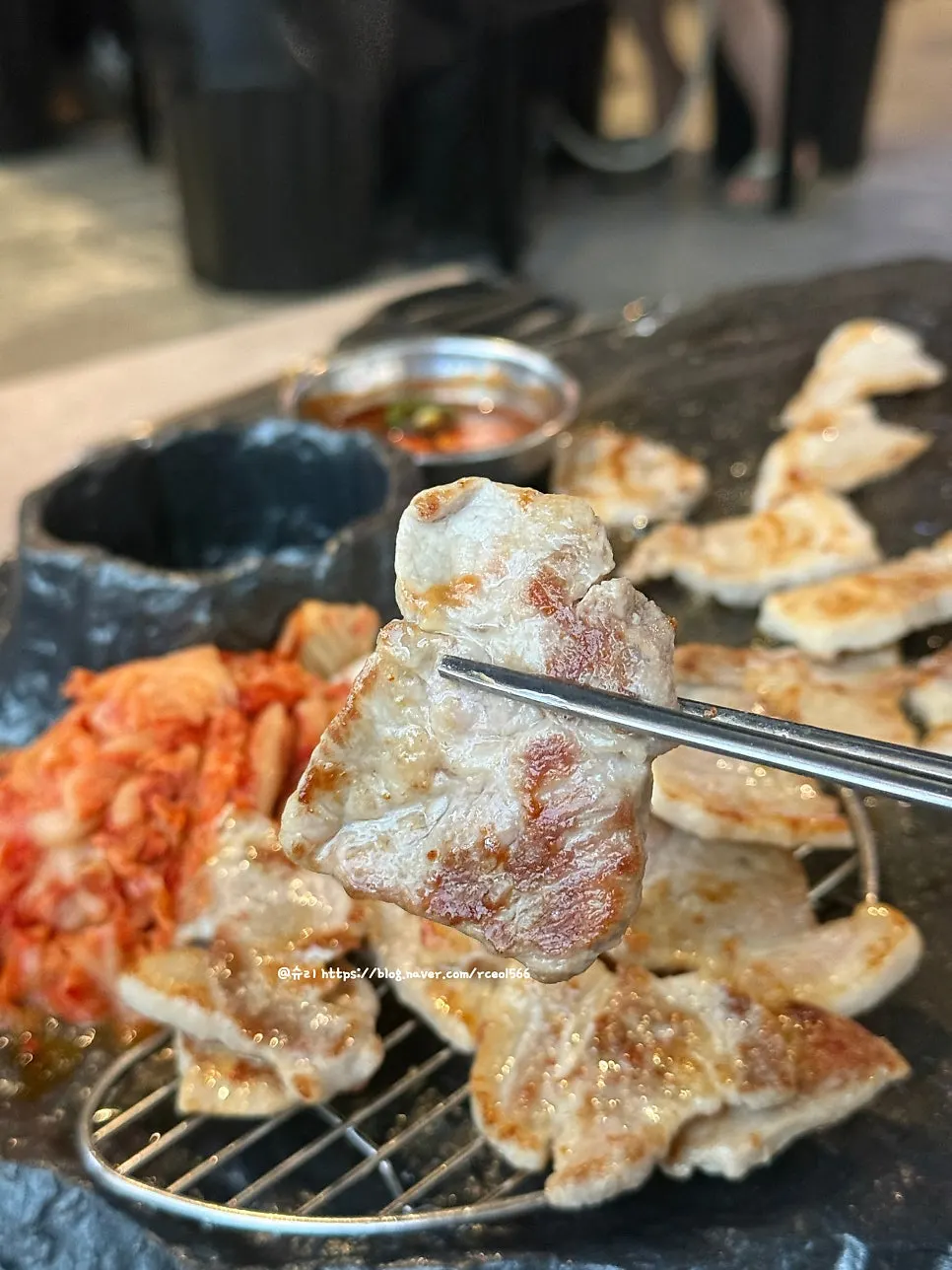 Fully cooked meat moved onto the flat plate