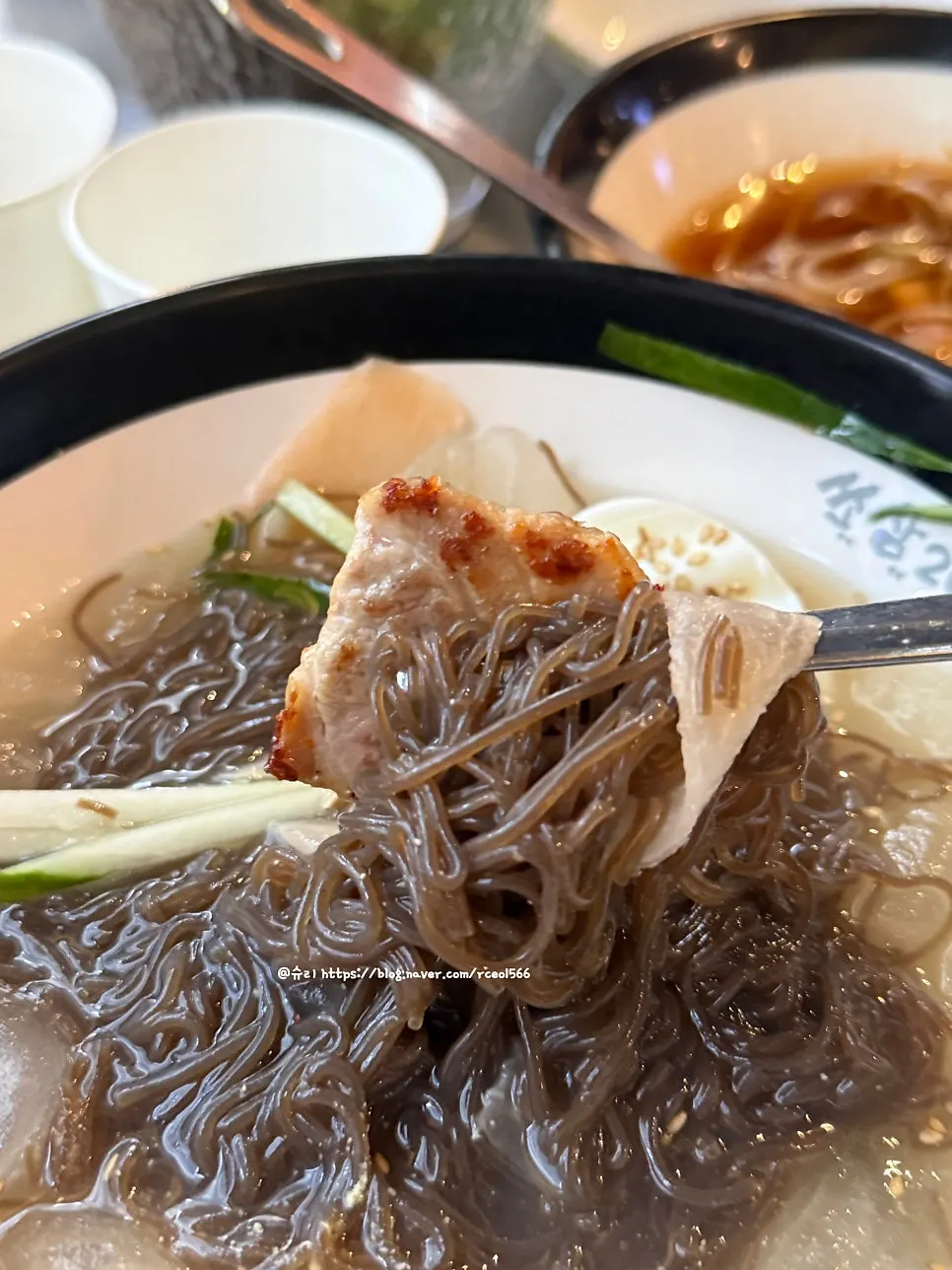 The refreshing mul-naengmyeon ordered alongside the meat