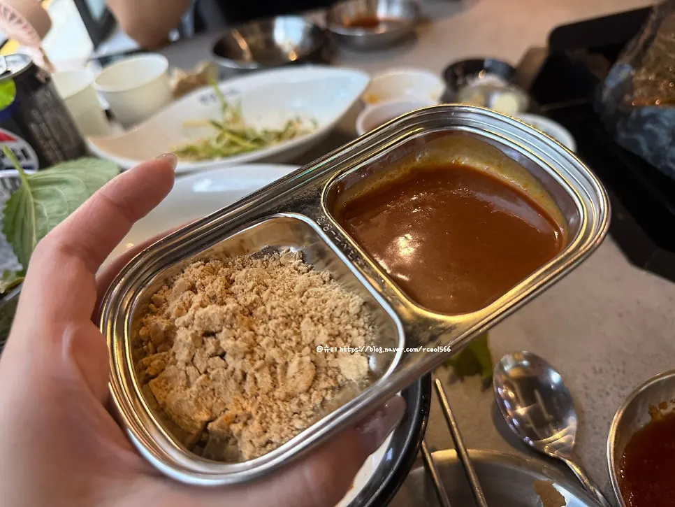 Wrapping naengmyeon noodles together with grilled meat