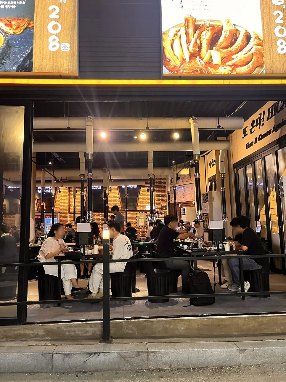 Front of the restaurant with the glass front opened for an outdoor-patio feel