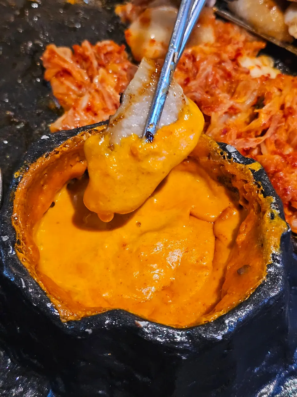 Cheongyeopsal dipped in lava fondue cheese