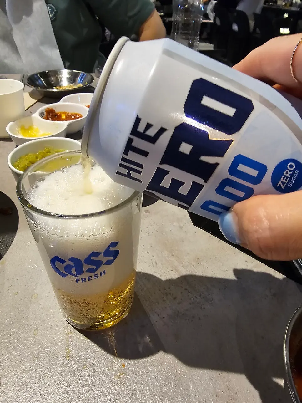 A shot of soju enjoyed with the pork belly