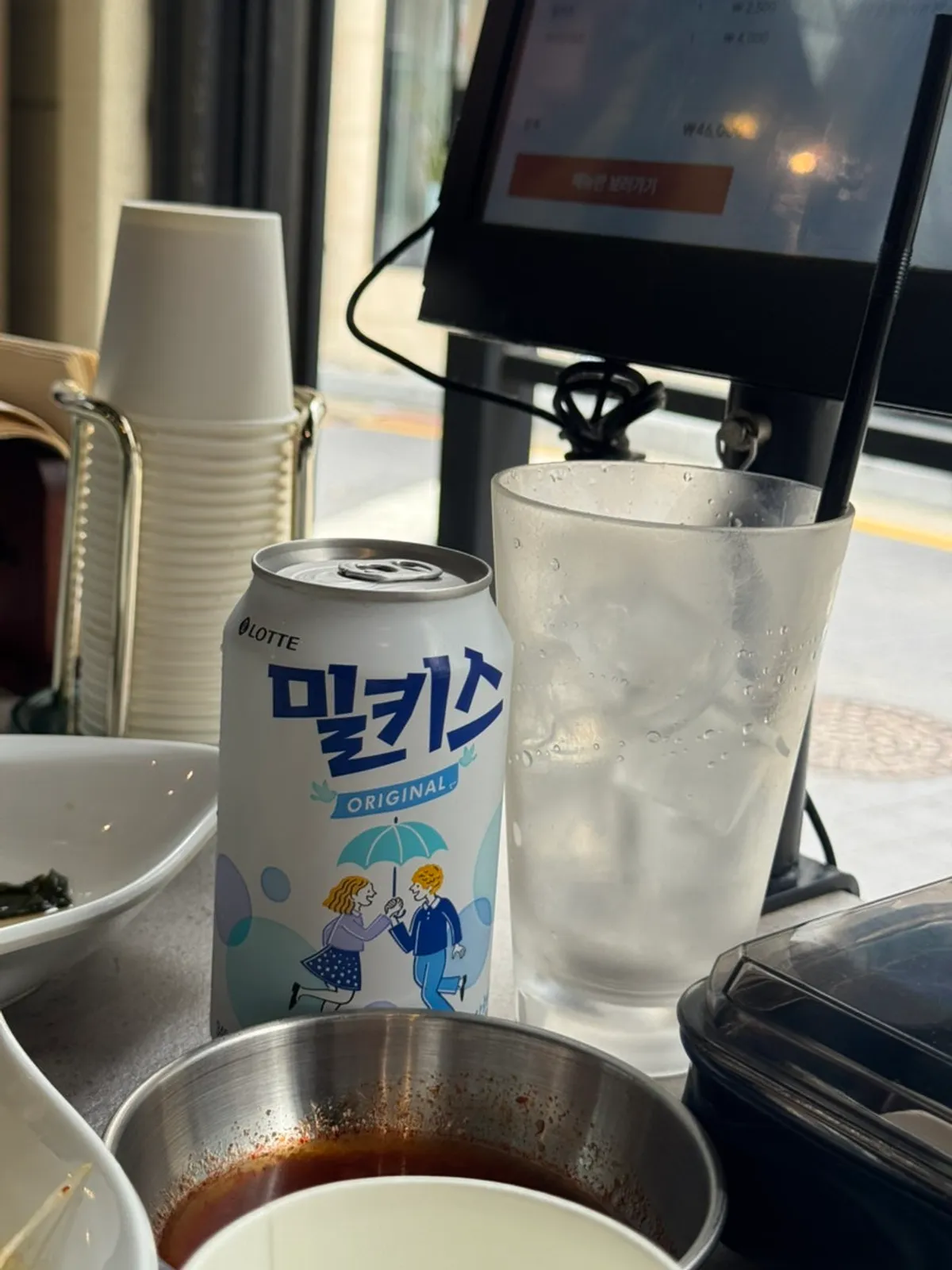 Non-alcoholic beer alongside stone-grilled pork belly