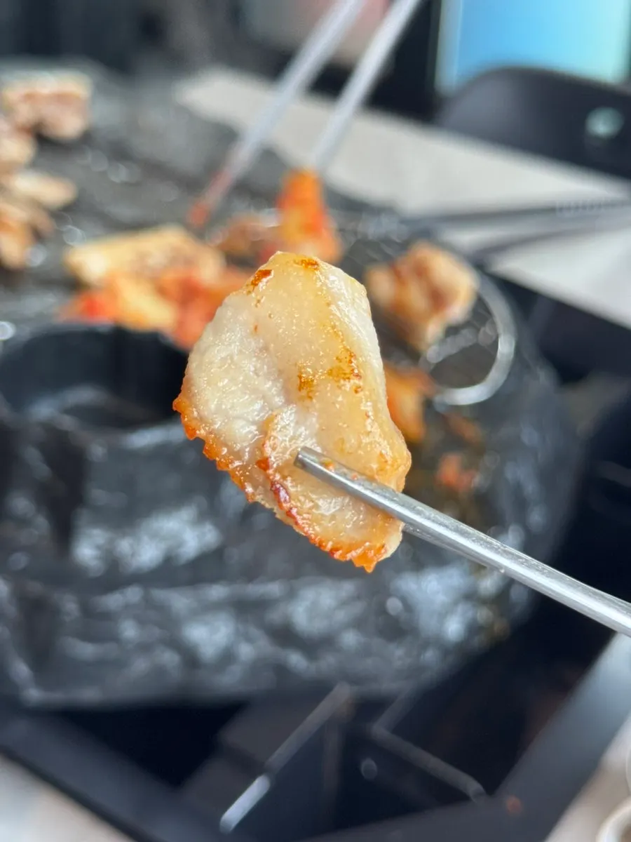 A piece of crisply grilled pork belly
