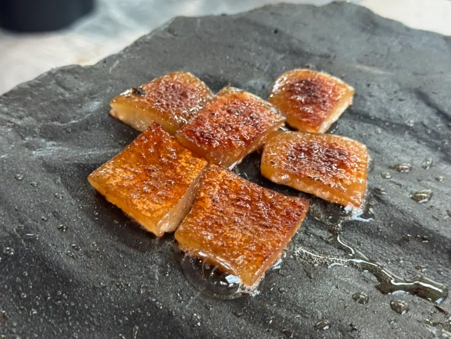 Pork skin grilling on the stone plate