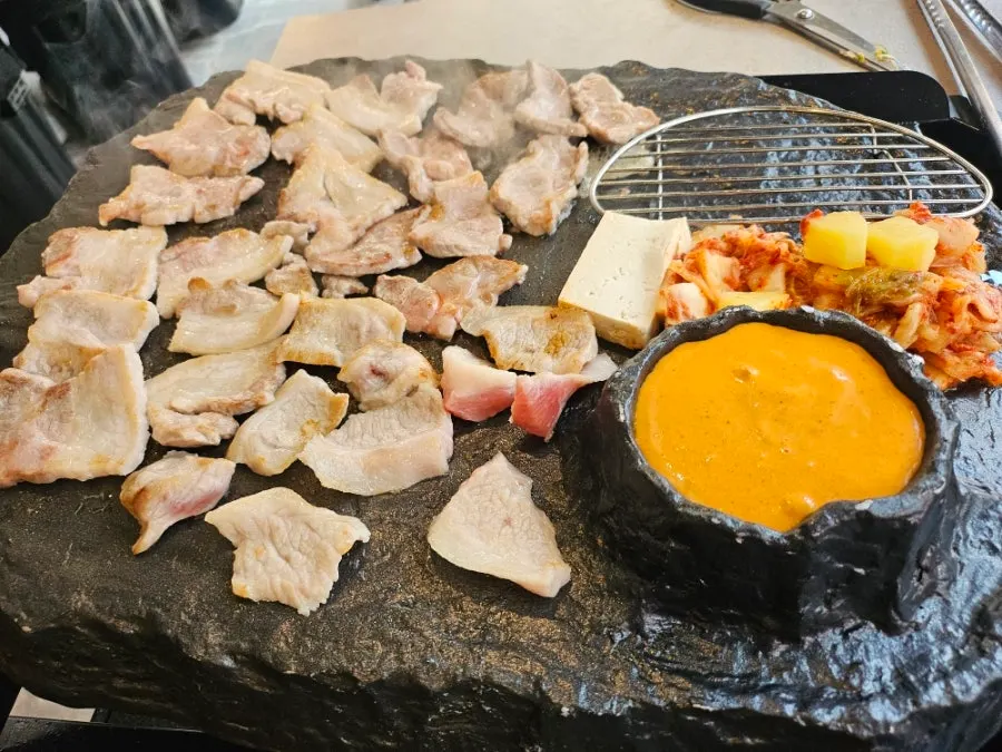 Plate of raw meat from the mixed stone-grill platter