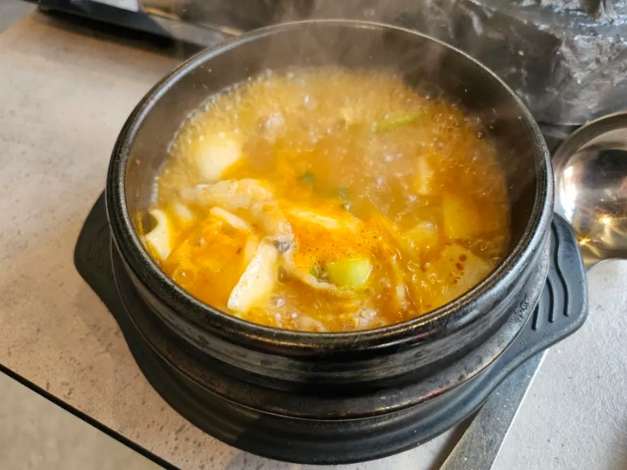 Grilled meat dipped in cheese sauce
