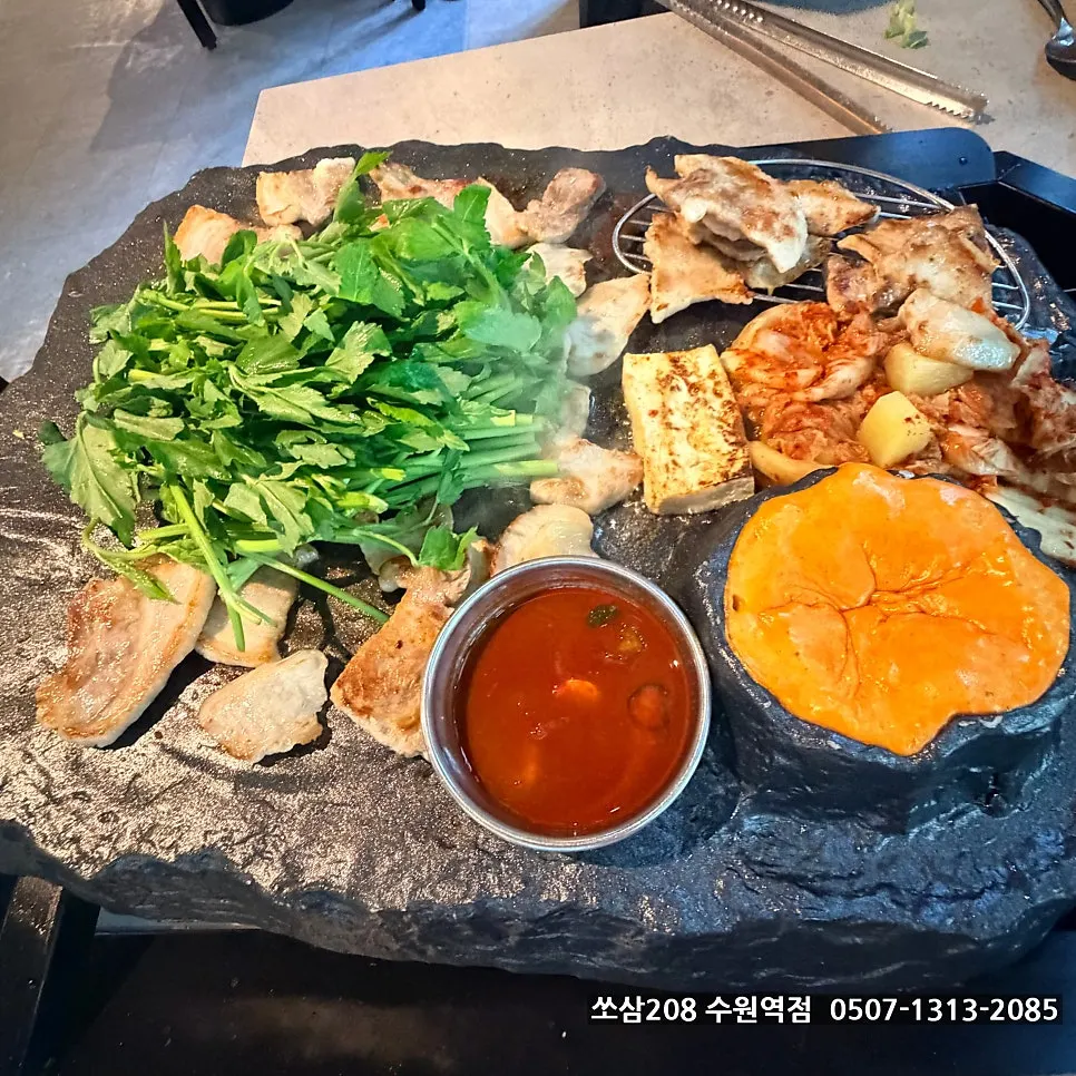 Grilled pork belly paired with kimchi on the stone plate
