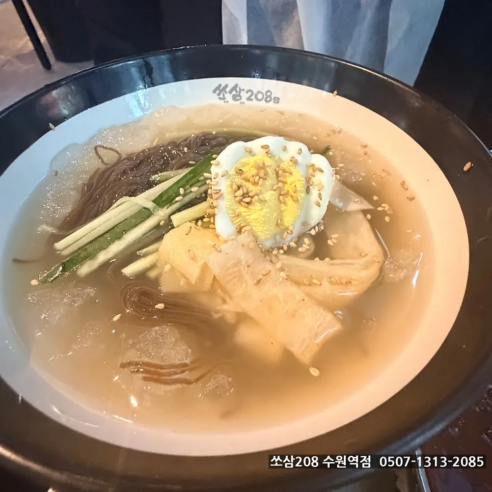 A bowl of mul-naengmyeon with icy slush broth