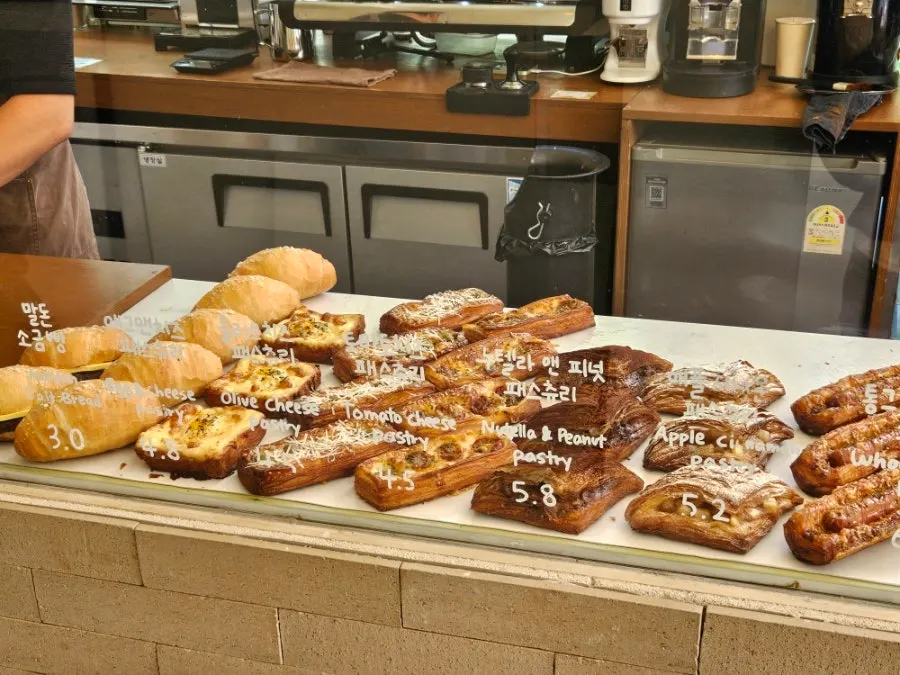Crookie sandwiches and chocolate and egg custard flans on display