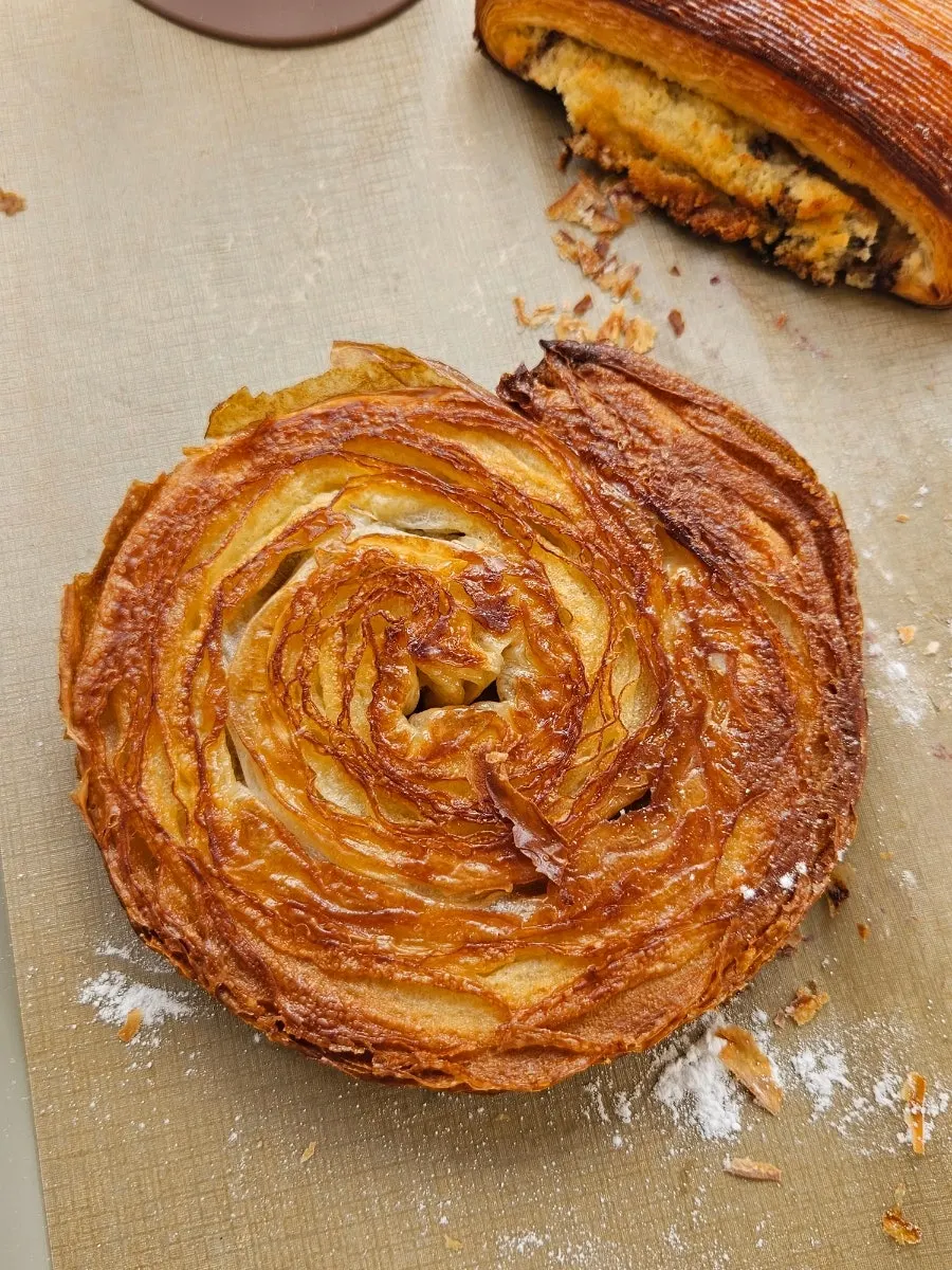 Blueberry ricotta croissant dusted with powdered sugar
