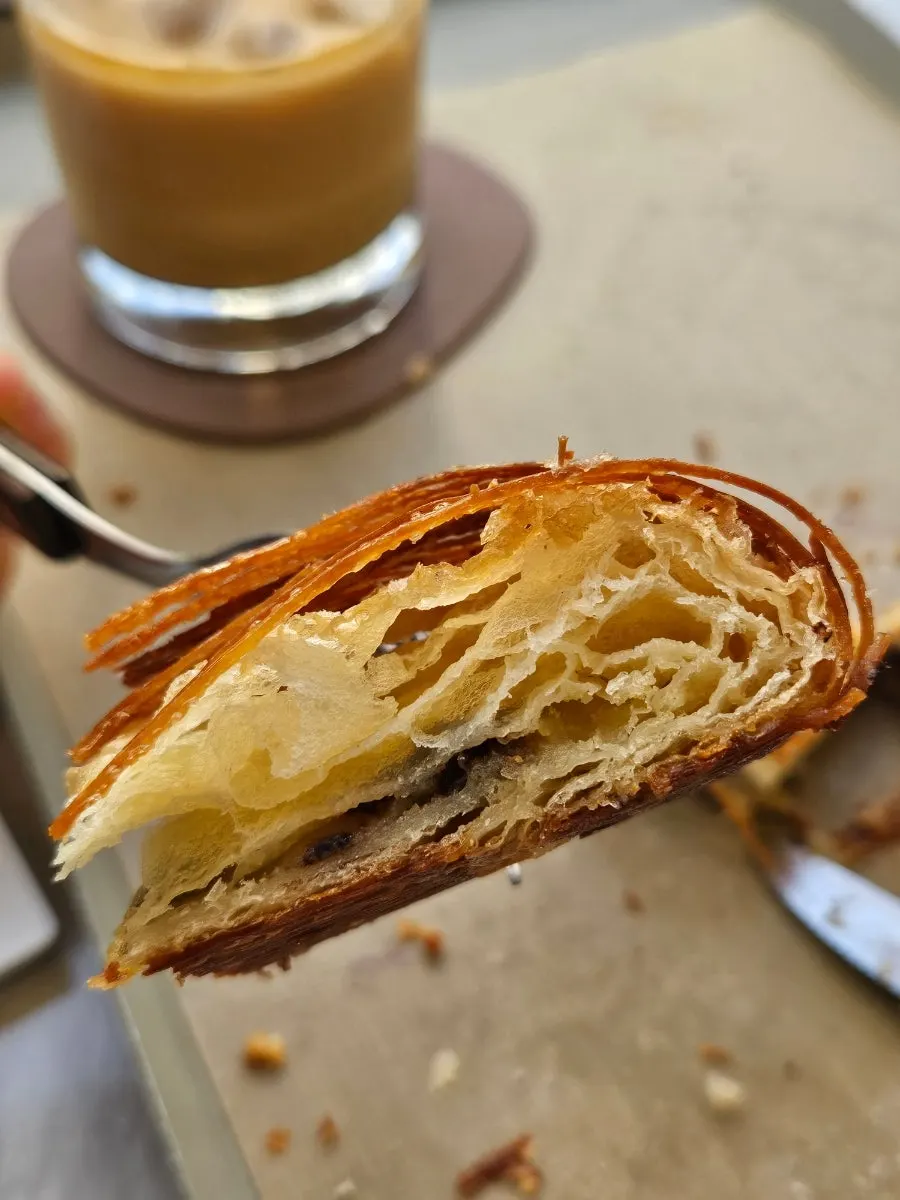 Inside of the almond pain suisse studded with chocolate chips