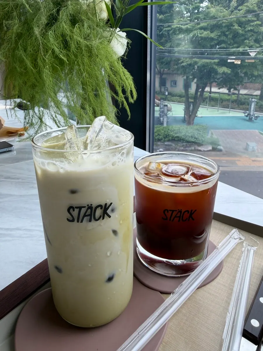 Two cups of green tea latte and americano