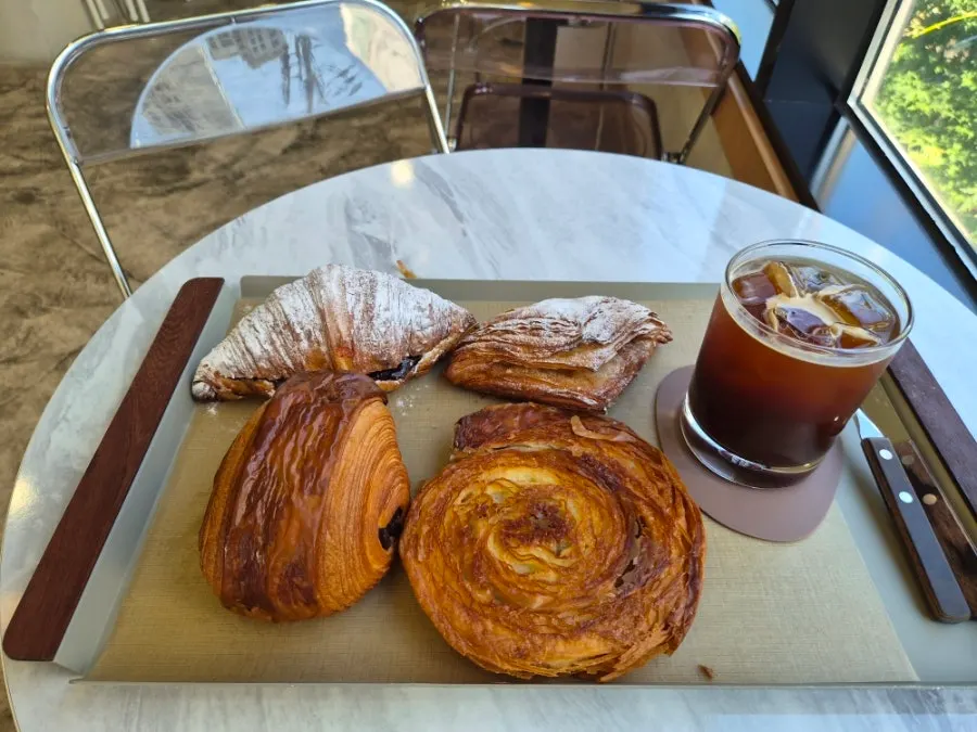 Table view of pastries and coffee at Stack Bakery