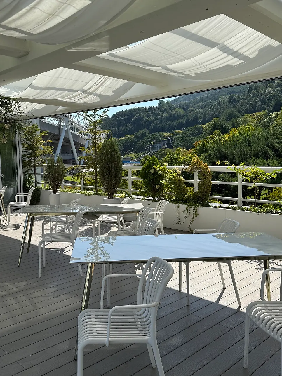 Outdoor ceremony space with guest parasols prepared