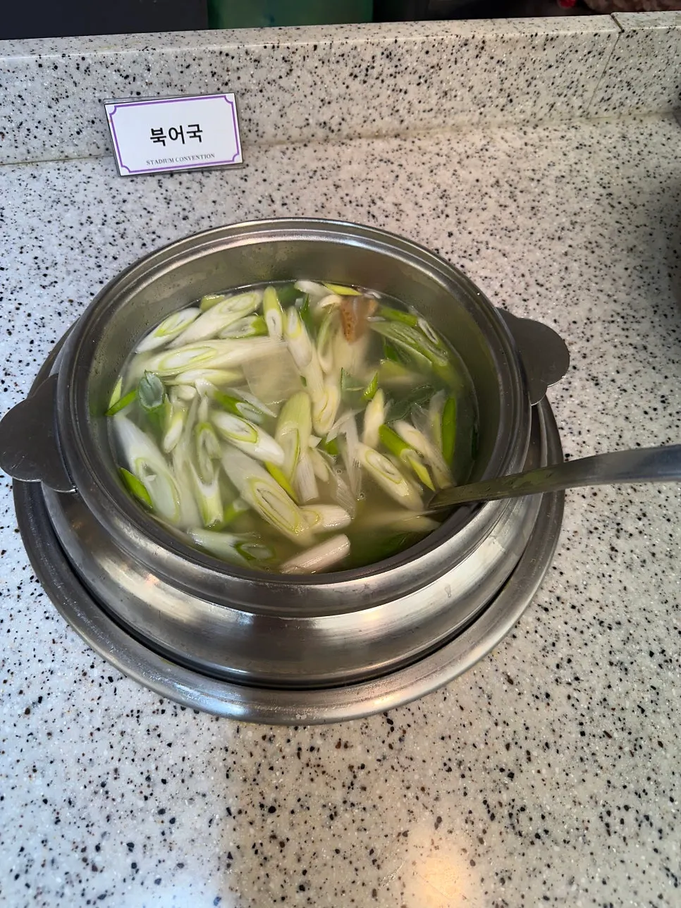 Korean food corner with soy sauce marinated crab and japchae