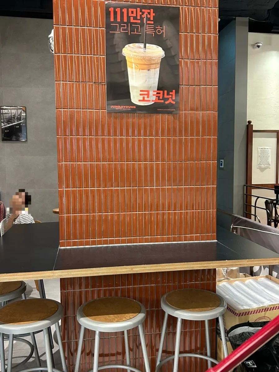 Bar seating for solo visitors and table seating further inside