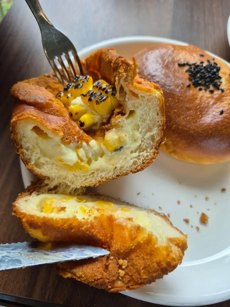 Warmed corn bread, red bean bread, and ciabatta