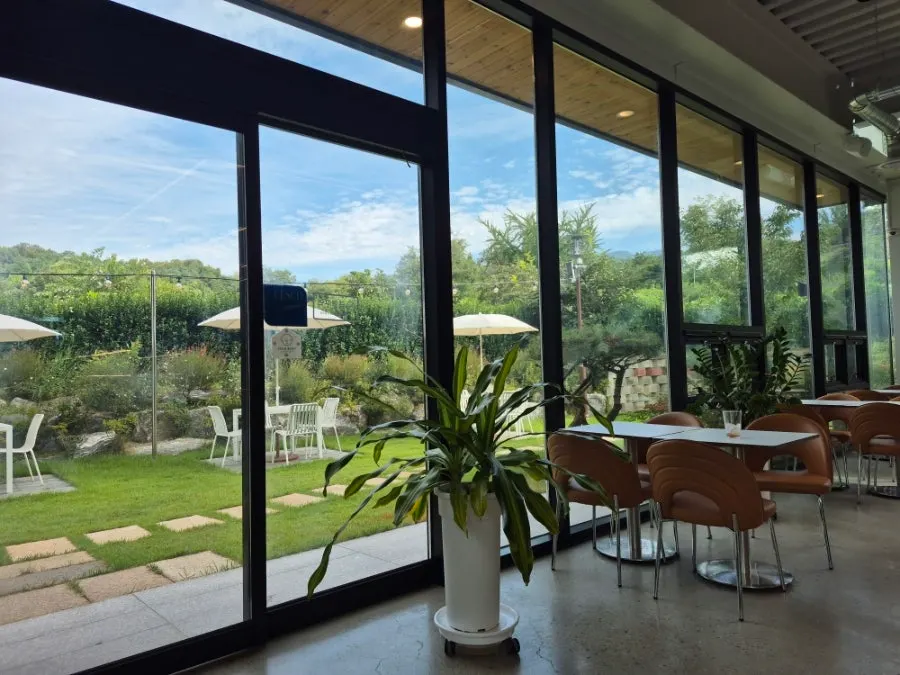 1st floor seating with lots of windows at Steel Green Bakery
