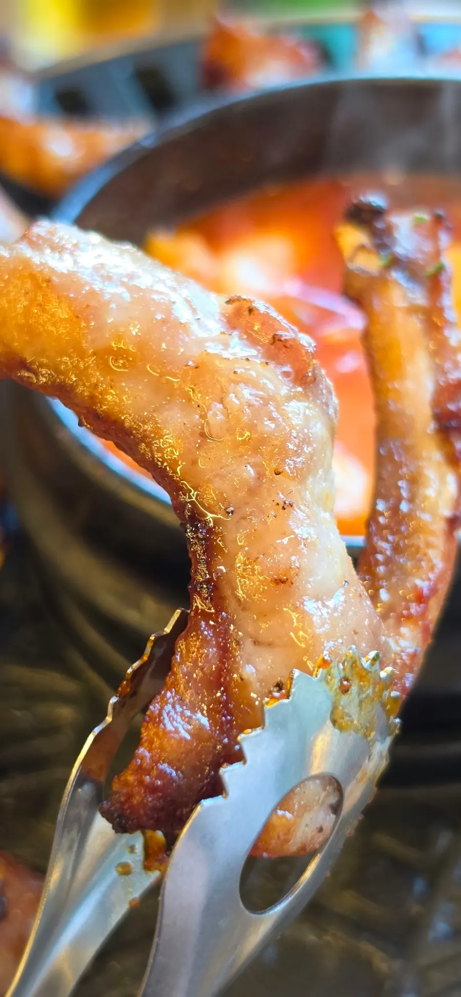 Close-up of sauce-coated spicy jjokgalbi