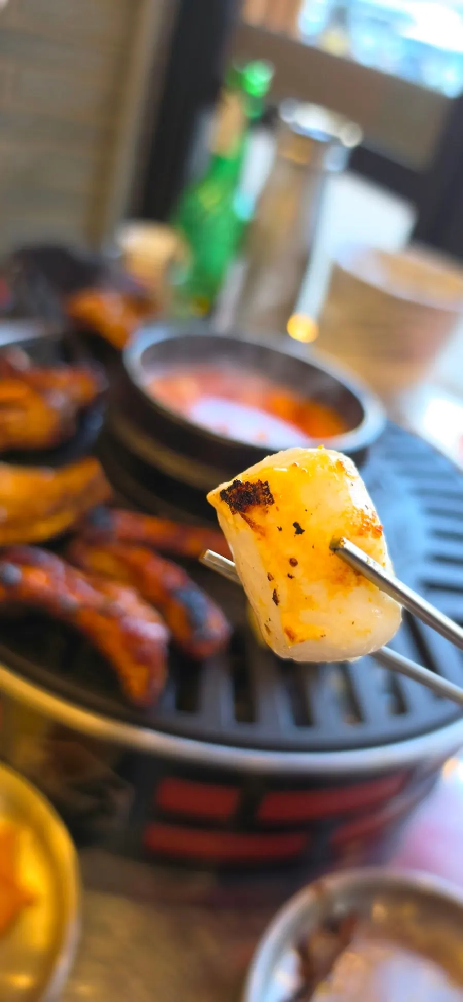 Picking up a piece of jjokgalbi
