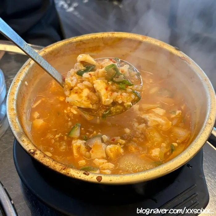 A bowl of spicy sundubu jjigae broth