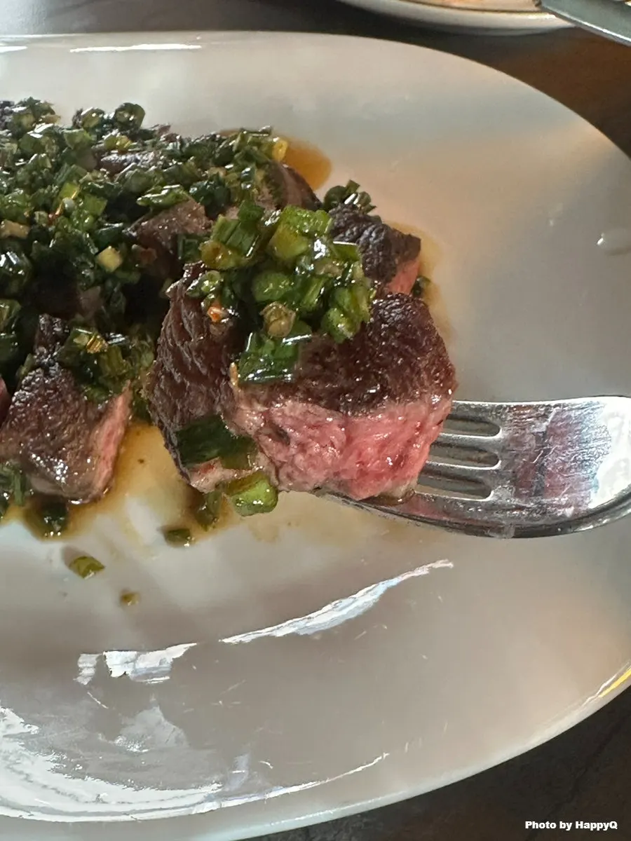 Cross-section of steak strips with oregano sauce