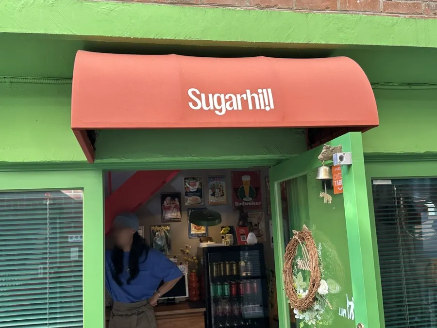 Sugar Hill's exterior with a European alley café feel