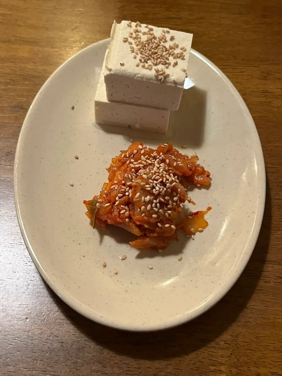 Starter dish of tofu and stir-fried kimchi