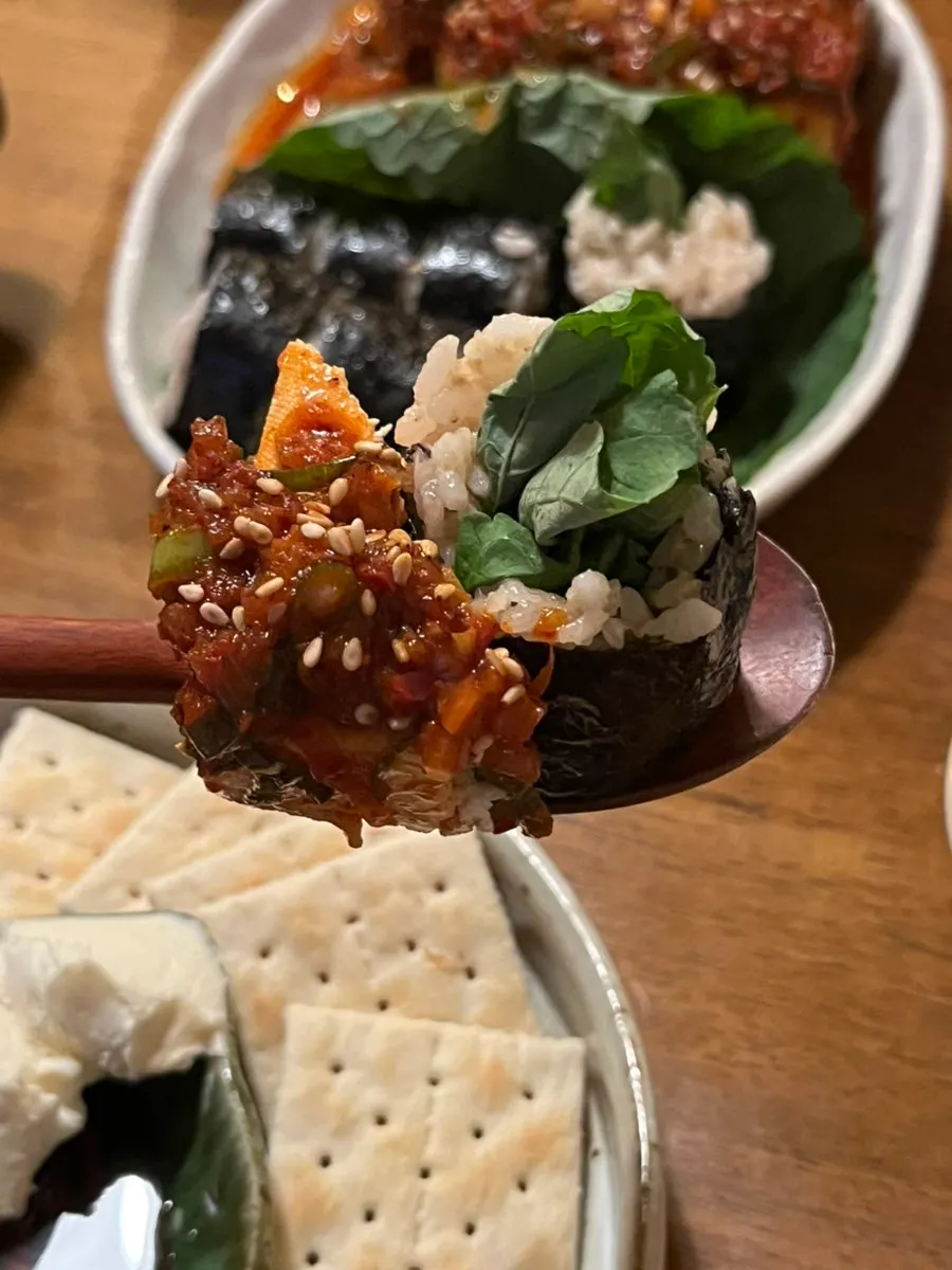 A piece of braised tofu eaten with rice