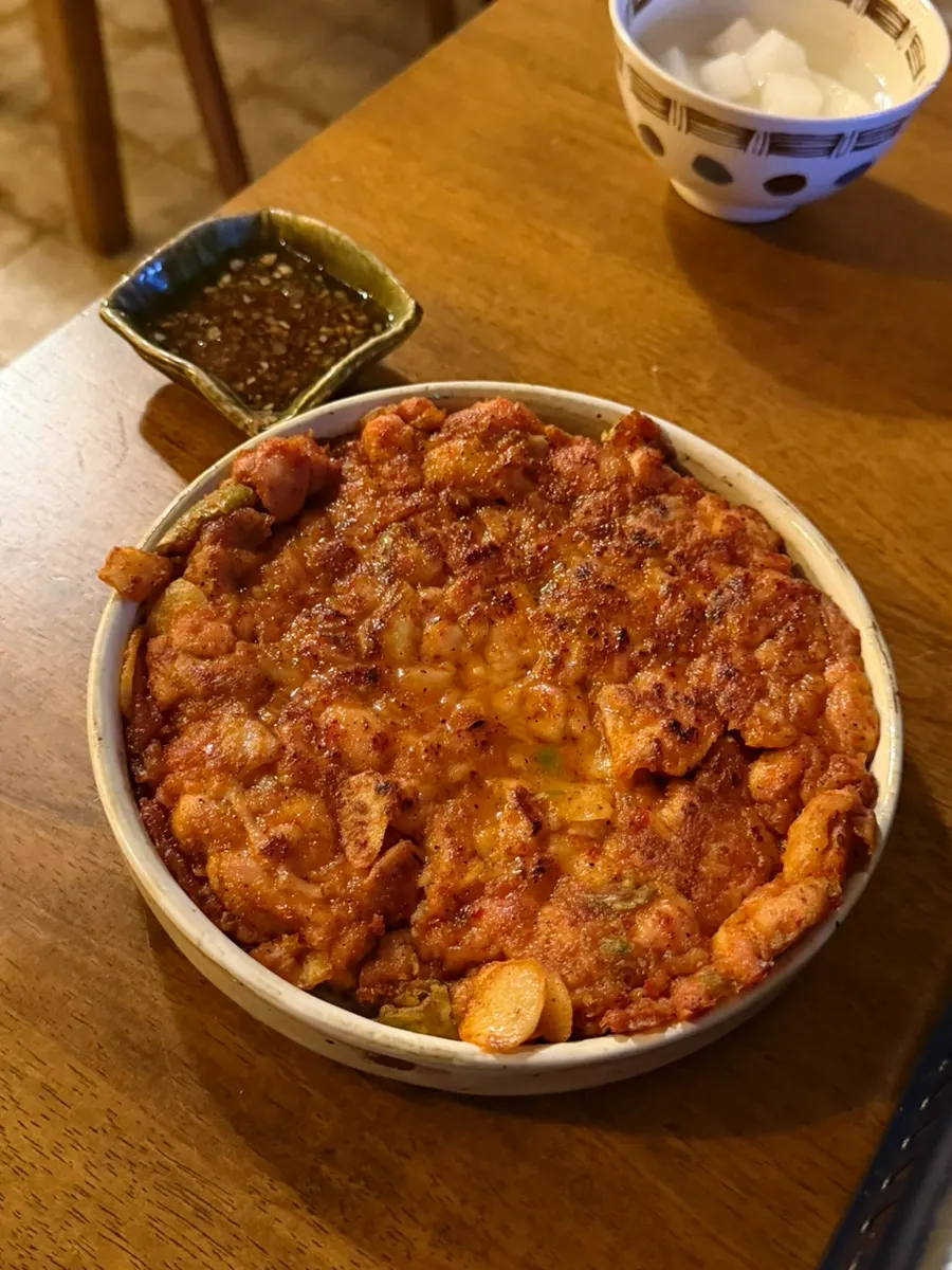 A piece of glass noodle soaked in sauce