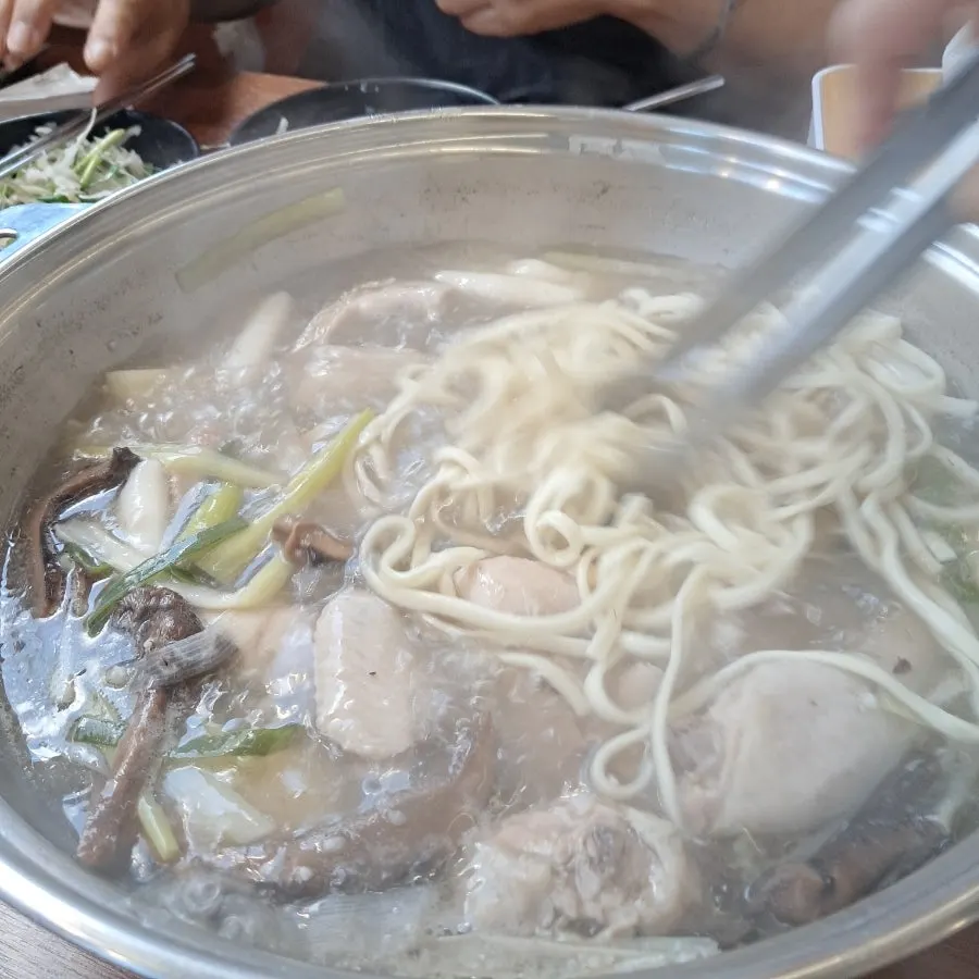Kalguksu noodles cooked in the neungi broth