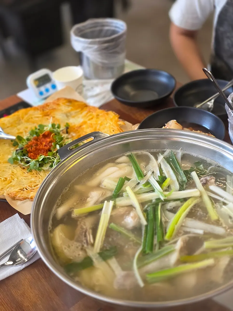 Close-up of the dak hanmari broth starting to boil