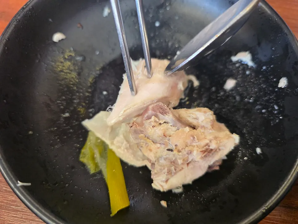 Chicken being fished out after the timer goes off