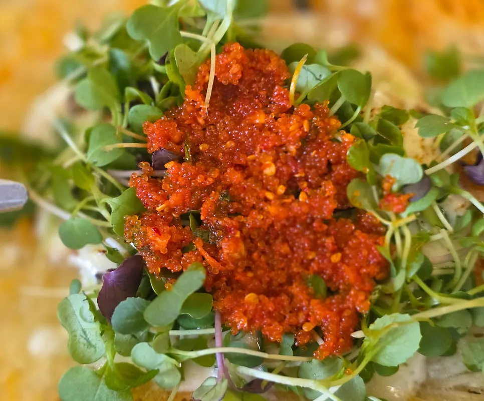 Full view of the potato pancake topped with flying fish roe