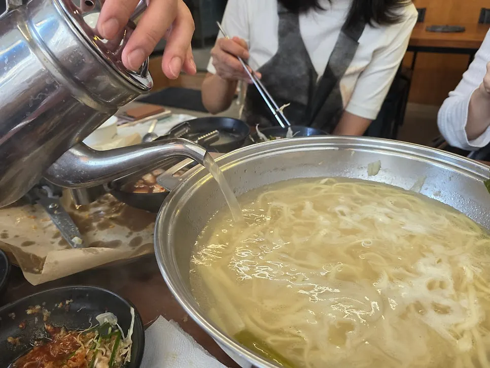 Noodles being boiled in the broth