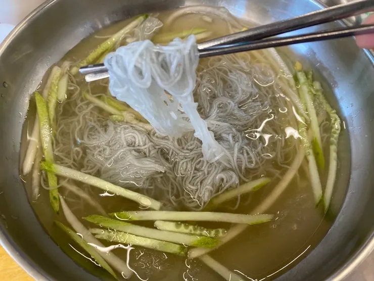Cool mul naengmyeon served alongside the meat