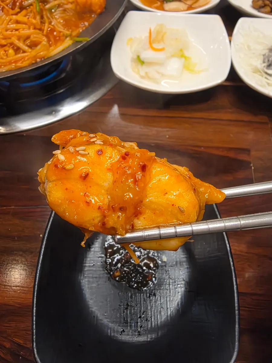 Agu-jjim piled generously with bean sprouts